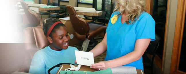 staff with happy patient